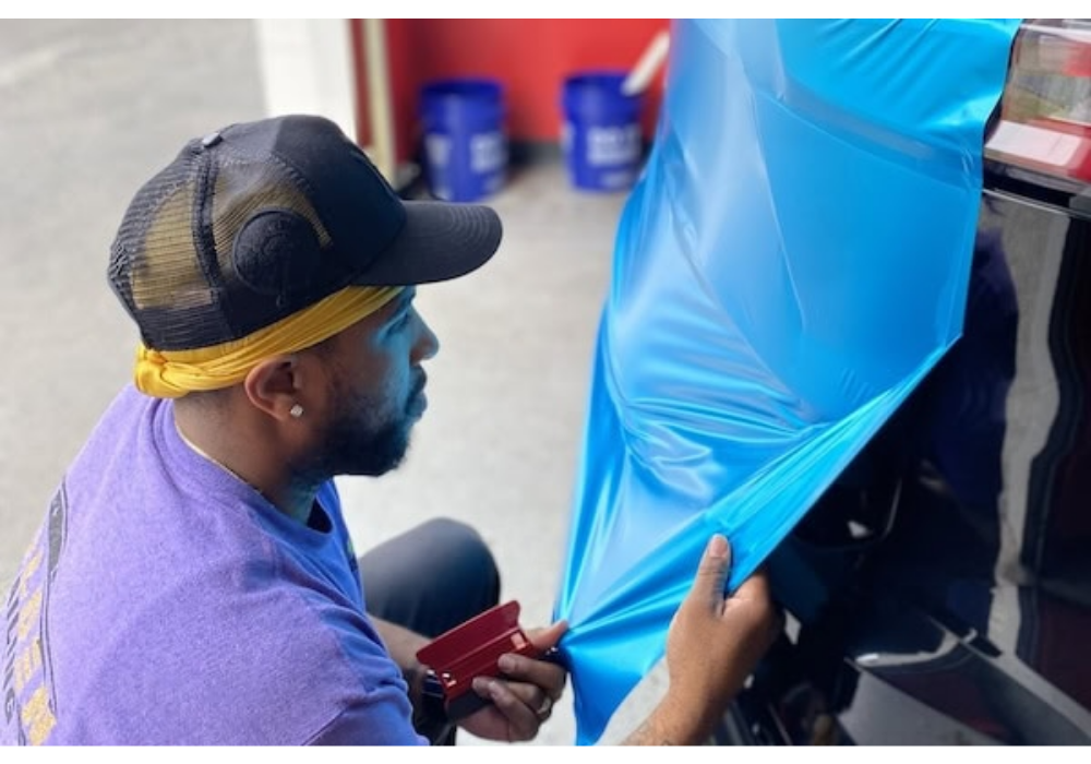 3M Vehicle Color Change Installation Training. Man learning how to install 3M Wrap Film Series 2080.