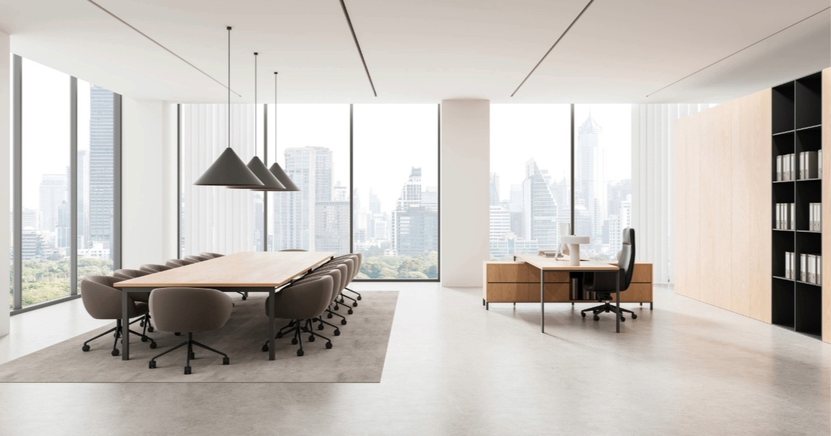 Commercial office interior with sun control window film reducing glare on large windows while maintaining natural daylight.