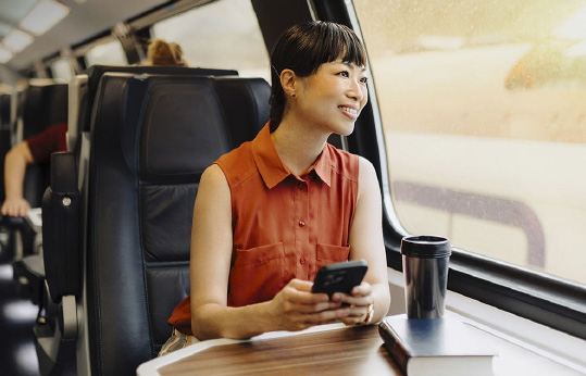 Woman on a bus looking out the window